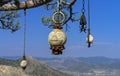 Four stone idol hanging on a pine tree in the Crimean mountains