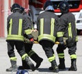 four stretcher bearers carring an injured person