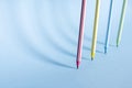 Four striped colored pencils stand upright Royalty Free Stock Photo