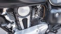 Four-stroke internal combustion engine of an unusual shape of an old touring motorcycle in close-up Royalty Free Stock Photo