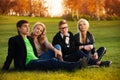 Four students sitting on the loan