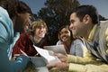 Four students studying outdoors