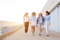 Four students walking down walkway Royalty Free Stock Photo