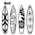 Four surfboards with different black and white designs and the word surf in the upper left corner Royalty Free Stock Photo
