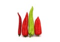 Four sweet ripe red and green peppers on a light background. Royalty Free Stock Photo