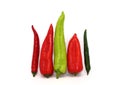 Four sweet ripe red and green peppers on a light background. Royalty Free Stock Photo