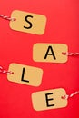 Four tags with the word sale on red background. Vertical foto