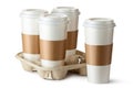 Four take-out coffee. Three cups in holder. Royalty Free Stock Photo