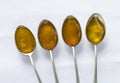 Four teaspoons honey Royalty Free Stock Photo