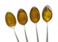 Four teaspoons honey Royalty Free Stock Photo