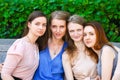 Four Teenage Girls Sitting On Bench In summer Park Royalty Free Stock Photo