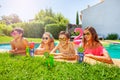 Friends having open air party by swimming pool Royalty Free Stock Photo