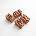 Four Terracotta Honeycomb Pattern Building Blocks on White Background brick building material Royalty Free Stock Photo