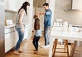 Four times the fun in their home. a happy family of four dancing together in the kitchen at home. Royalty Free Stock Photo