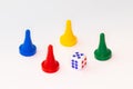 Four tokens with dice on white background Royalty Free Stock Photo