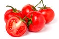 Four tomatoes and half with water droplets isolated white background Royalty Free Stock Photo