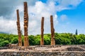 Four towering tiki in Poipu, Kauai, Hawaii