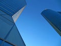 A low angle of two skyscrapers of the Four towers of Madrid.