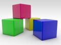 Four toy blocks of different colors on a white Royalty Free Stock Photo