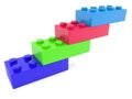 Four toy bricks of different colors are connected in the form of steps Royalty Free Stock Photo