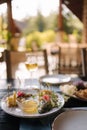 Four types of different cheeses sliced and served on a plate with honey sauce. Royalty Free Stock Photo