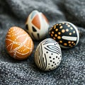 Four Unique Hand Painted Easter Eggs on Textured Fabric Royalty Free Stock Photo