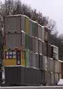 Four vertical rows of shipping containers that are different colors Royalty Free Stock Photo