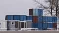 Four vertical rows of shipping containers that are different colors Royalty Free Stock Photo