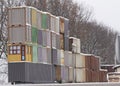 Four vertical rows of shipping containers that are different colors Royalty Free Stock Photo