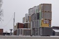 Four vertical rows of shipping containers that are different colors Royalty Free Stock Photo