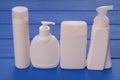 four vials of cosmetics, cosmetic bottles, assortment of cosmetic flasks, health and beauty