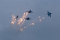 Four war jet planes in sky
