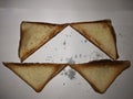 Four warm half-burnt toast on a white background.