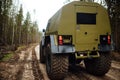 Large all-wheel drive all-terrain vehicle in the forest Royalty Free Stock Photo