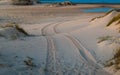 Four Wheel Drive car tire print on sand dune in the beach of Trafalgar, Cadiz, Spain. Royalty Free Stock Photo