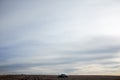 Four wheel drive car in desert under stormy sky