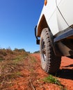 Four wheel drive wheel on red dirt road Royalty Free Stock Photo