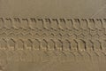 Four wheel drive tracks horizontal texture in sand Royalty Free Stock Photo