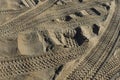 Four wheel drive tracks in soft sand textured background Royalty Free Stock Photo