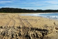 Four wheel drive tyre tracks on a beach Royalty Free Stock Photo