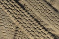 Four wheel drive tracks in soft sand textured background Royalty Free Stock Photo