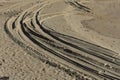 Curved four wheel drive tracks in soft sand Royalty Free Stock Photo
