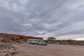 Four wheel drive vehicle and large white caravan