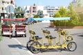 Four-wheeled bicycle outdoors on sunny day, space for text Royalty Free Stock Photo