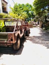 four-wheeled vehicles with the type of jeep parked in front of the house