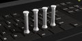 Four classical pillars on a black computer keyboard. 3d illustration