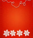 Four white crochet snowflakes in a row with a chain of white bead spheres on the top