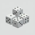 Four white cubic dice with black dots, arranged in a cluster on a plain gray background. Royalty Free Stock Photo