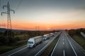 Four White Lorry Trucks Convoy on highway