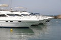 Four white motor yachts